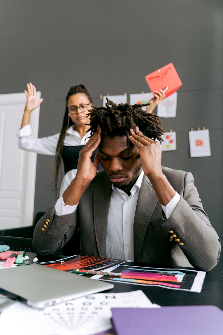 a man touching his head
