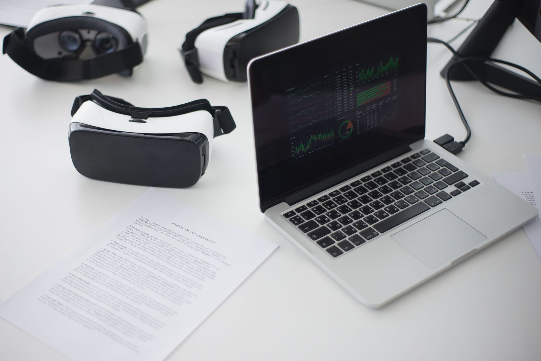 close up shot of a laptop beside vr glasses