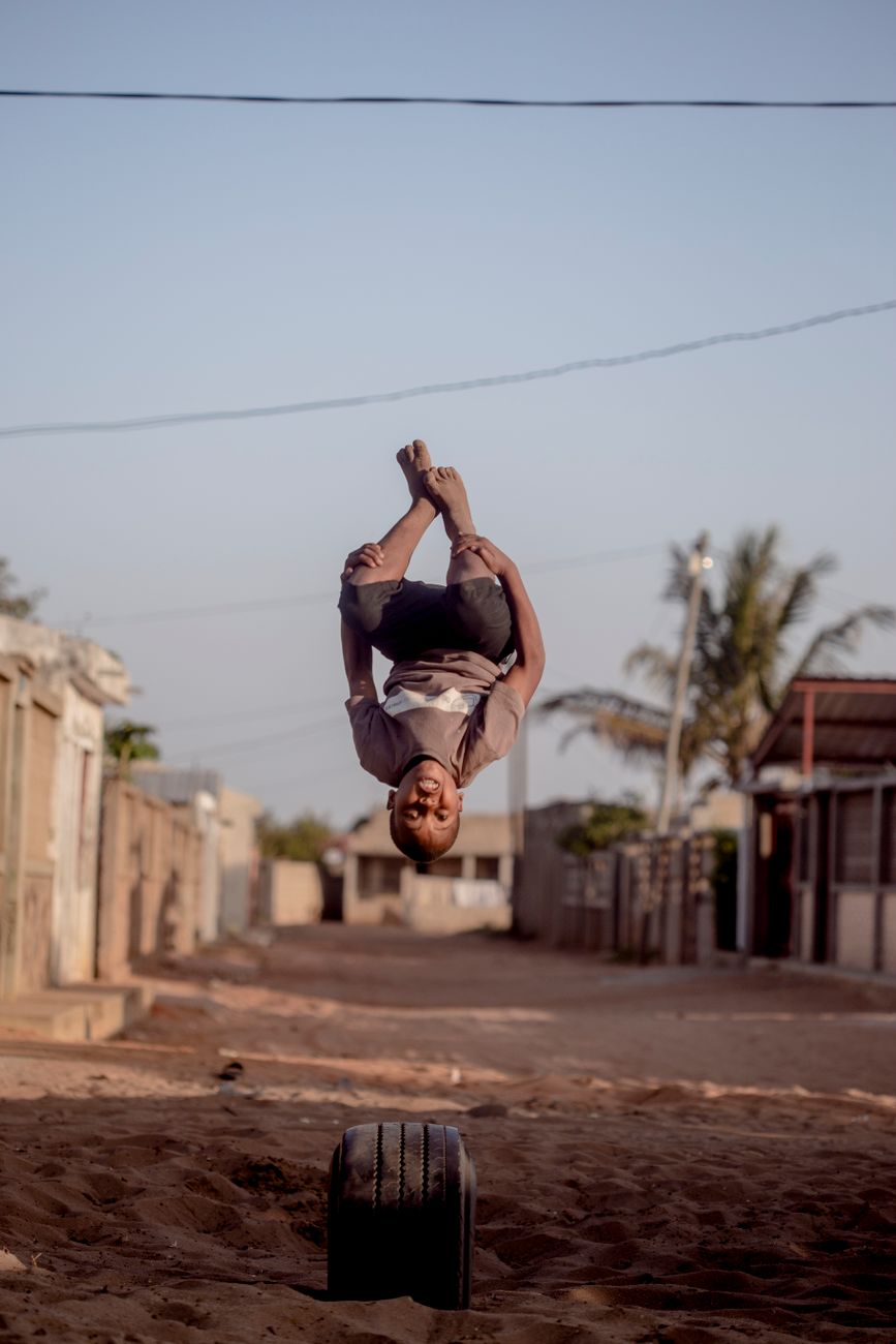boy jumping in village