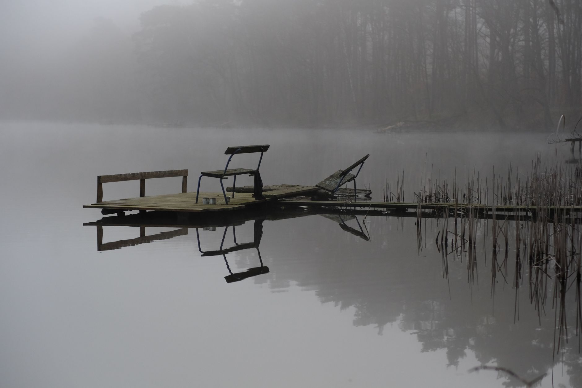 serene foggy lake pier at dawn