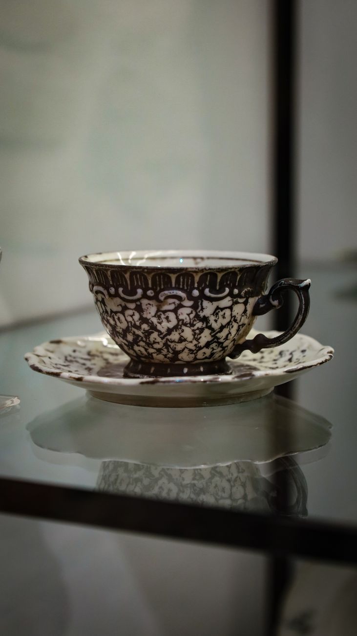 ornate coffee cup and saucer display