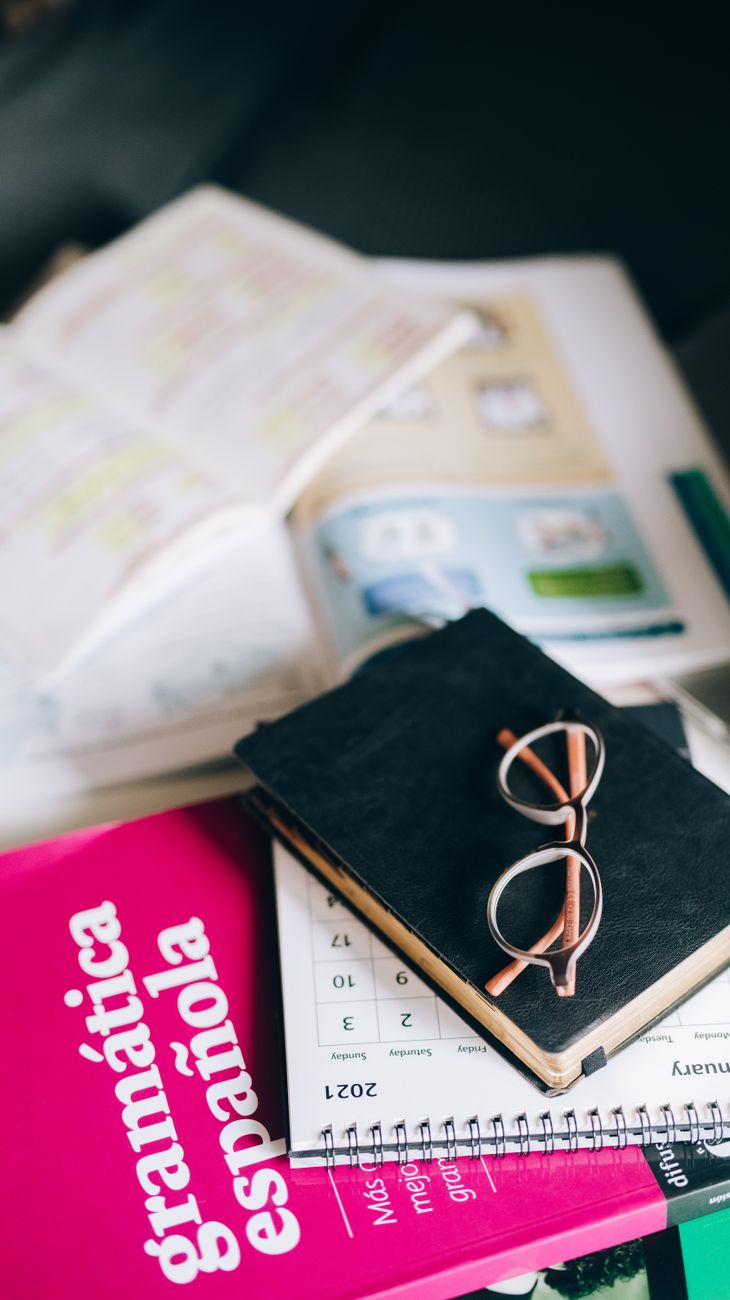 eyeglasses on top of black book