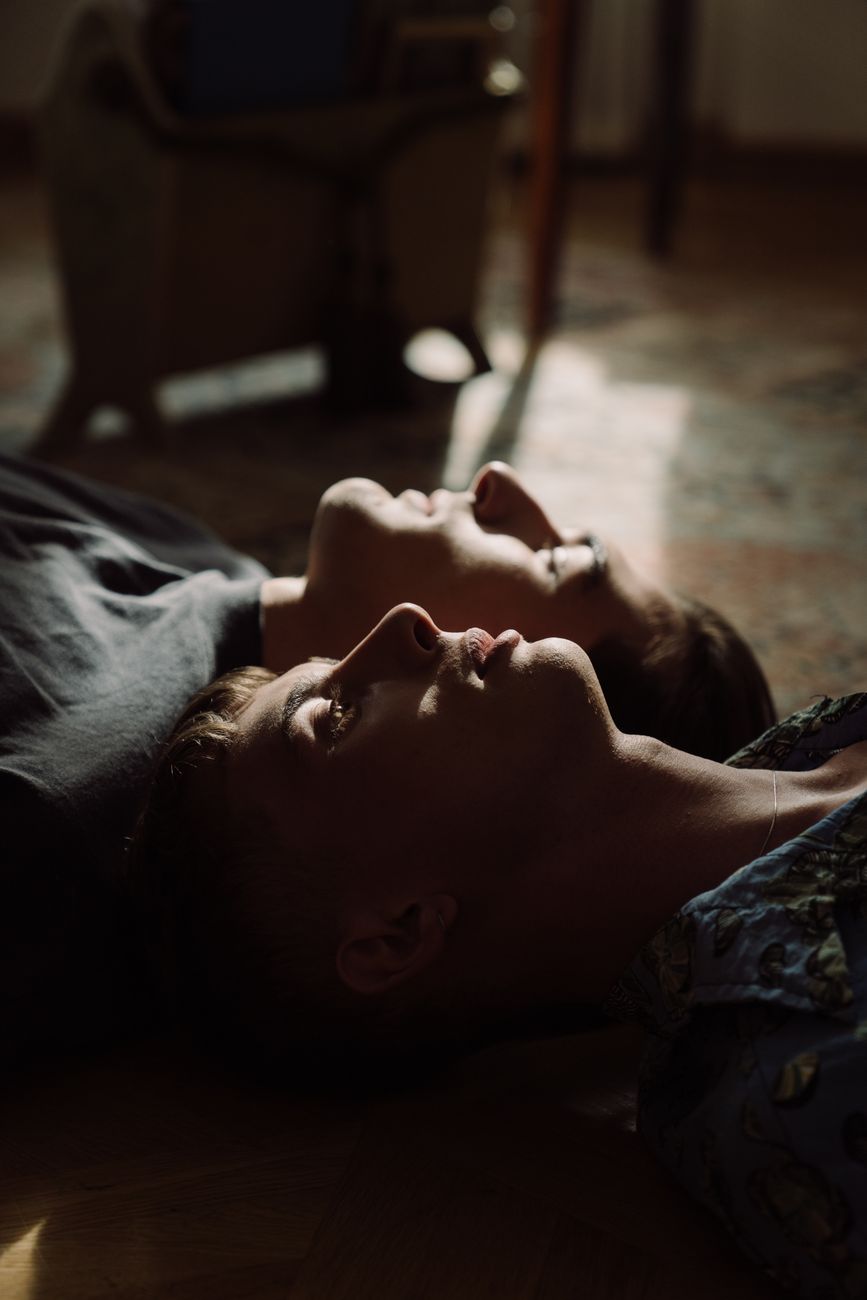 men lying on carpet