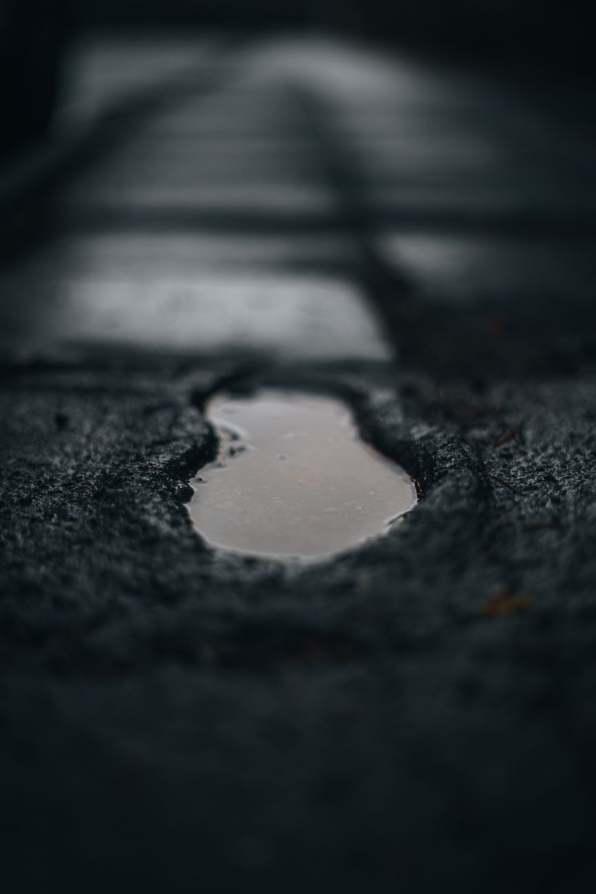 a footprint in the sand with water