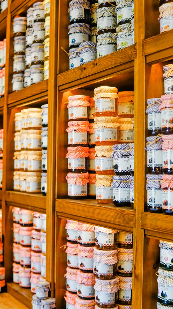 shelves with jars of jam and marmalade