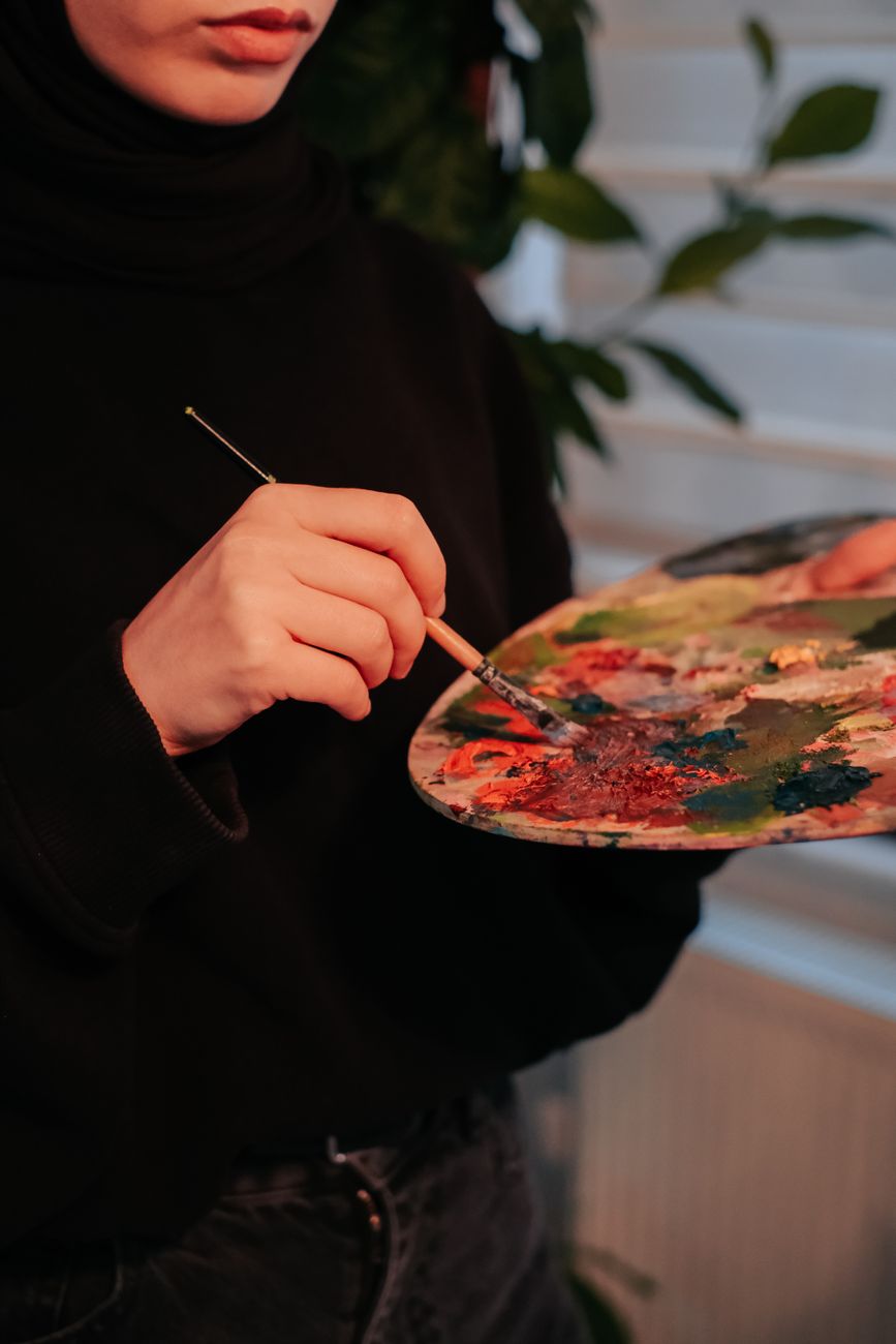 close up of woman painting