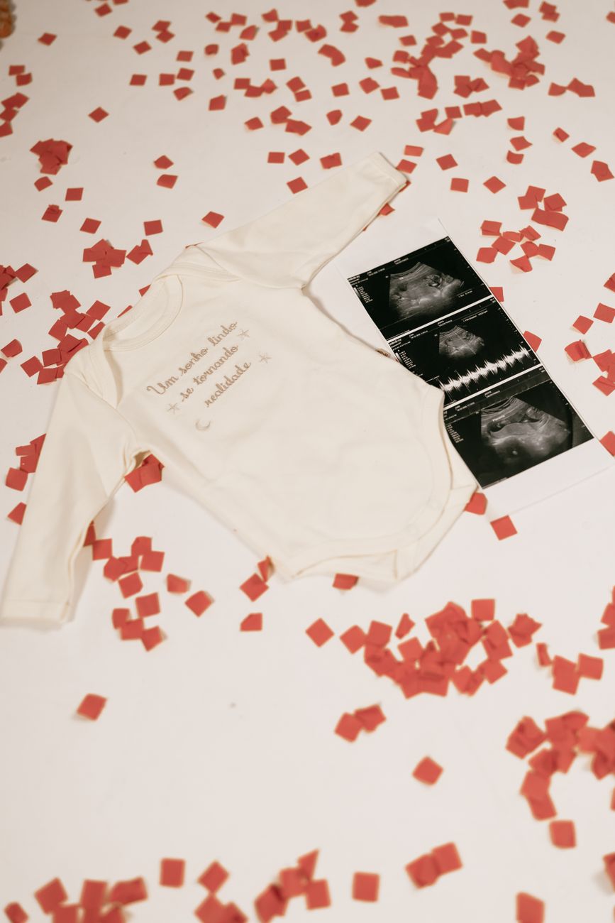 baby onesie with ultrasound and confetti