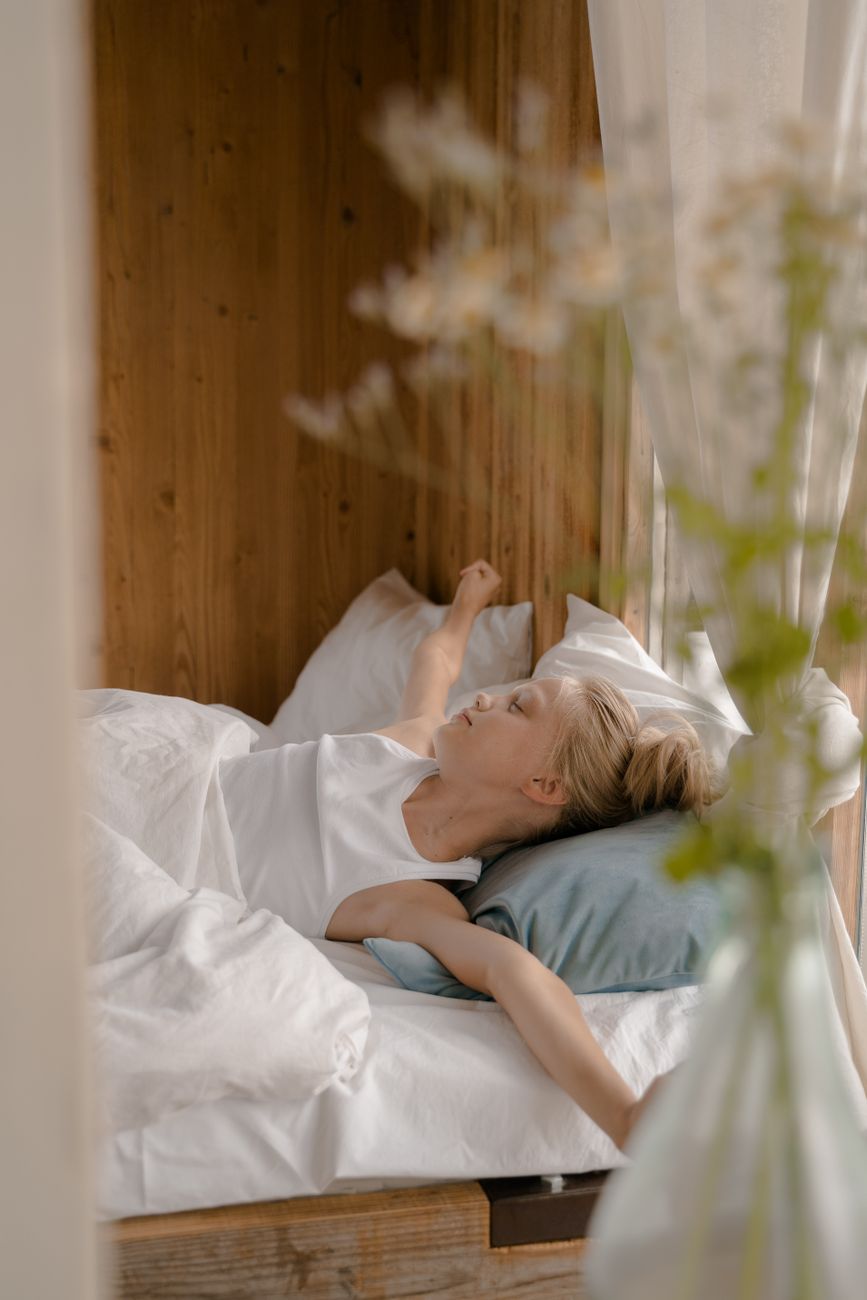 child stretching in bed