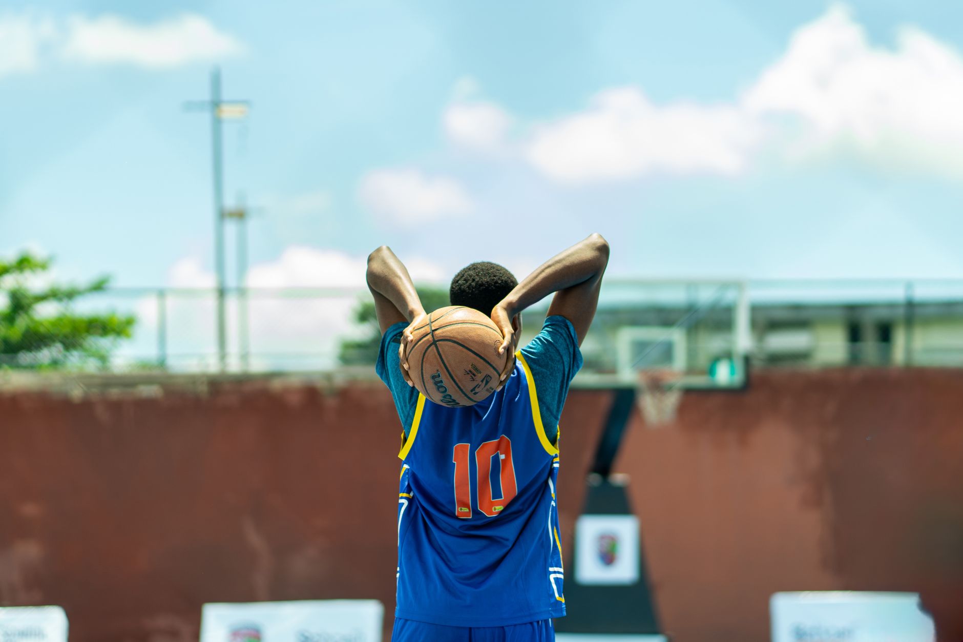 young basketball player practicing outdoors in nigeria