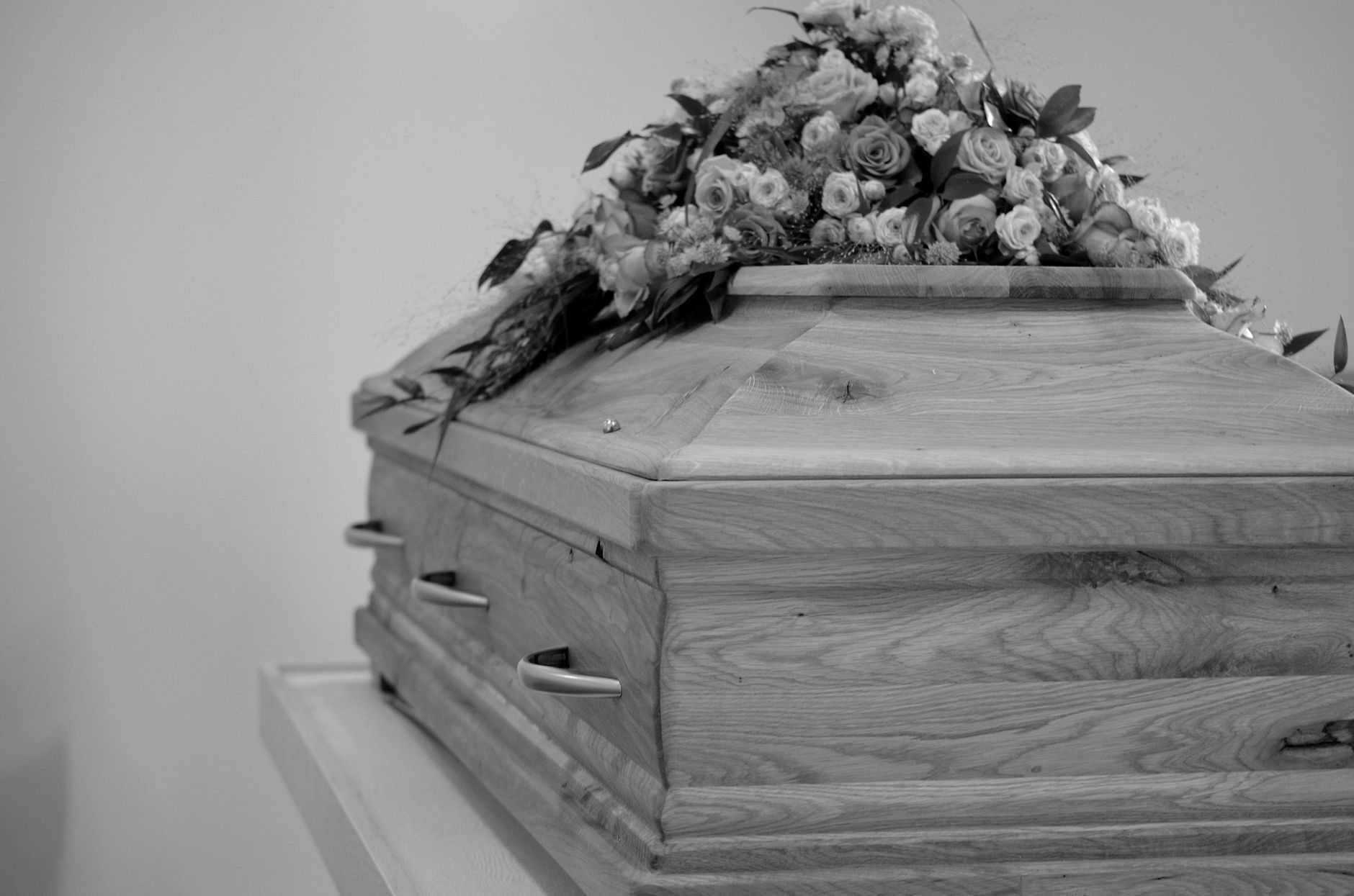 grayscale photo of a coffin